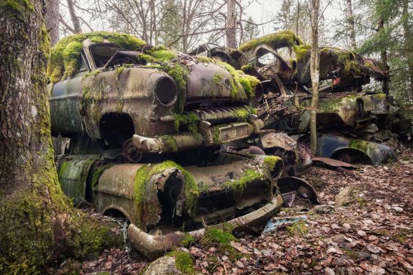 Car Cemetery In The Forest Sweden Featured Image
