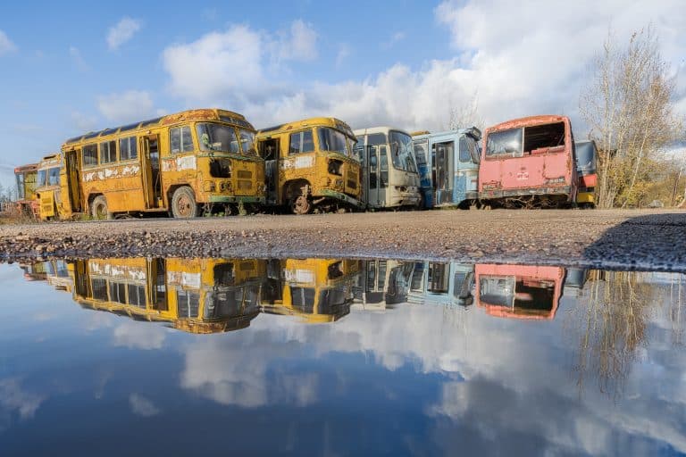Soviet Bus Graveyard Lithuania Featured Image